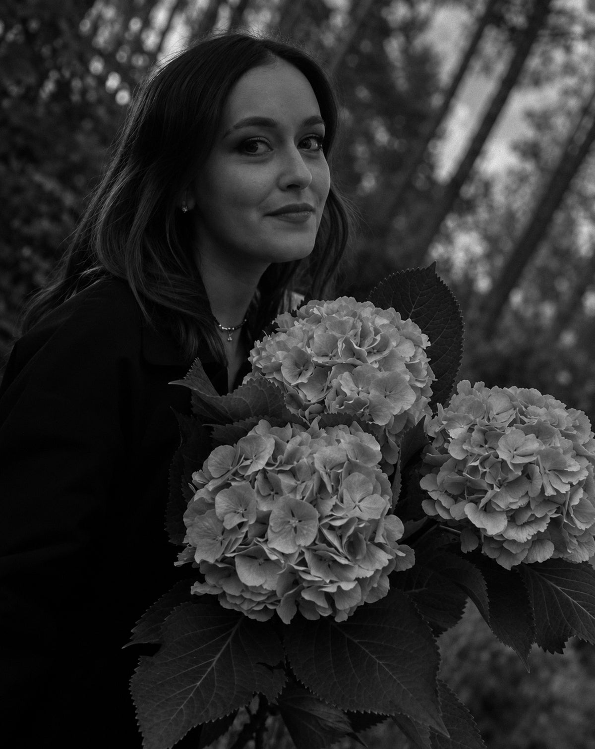 Olaysia Pavlova, influencer, holding hydrangeas