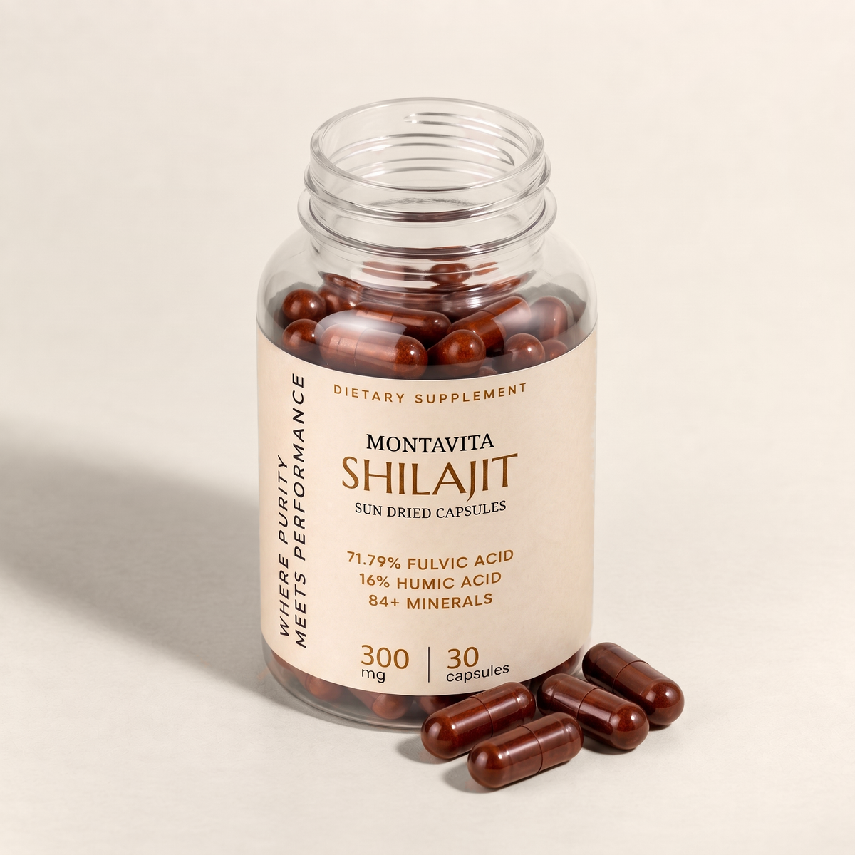 Montavita Shilajit Capsules bottle open with capsules scattered beside it